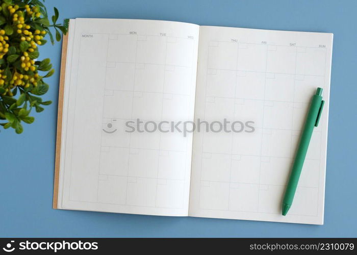 Blank notebook papers and pen on gray background, template, mock up, top view, flate lay