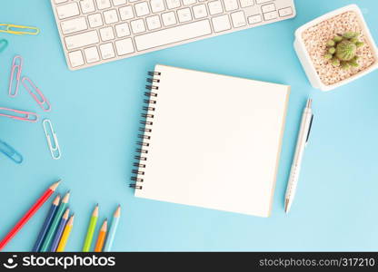 Blank notebook with keyboard and pen on blue background,Flat lay photo of notebook for your message