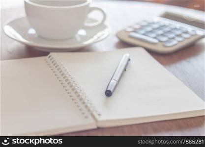 Blank notebook with pen on wooden table, stock photo