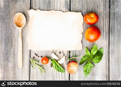 Blank old aged paper with copy space for recipe with ingredients and wooden spoon on the table. The Italian recipe