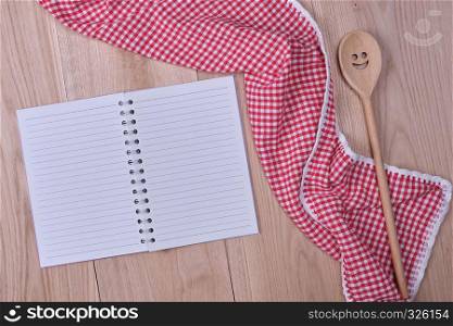 blank open notebook and wooden kitchen accessories, recipe concept,
