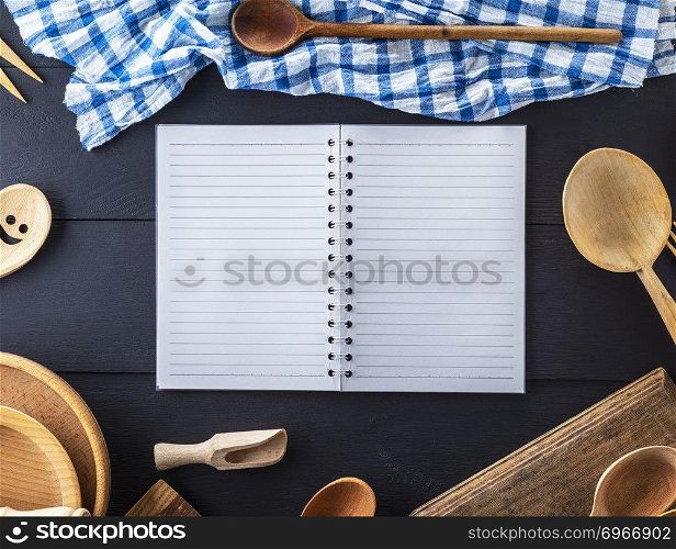 blank open notebook in line and wooden kitchen accessories, recipe concept