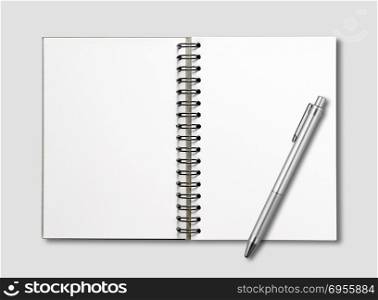 Blank open spiral notebook and pen mockup isolated on grey. Blank open spiral notebook and pen isolated on grey