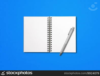 Blank open spiral notebook mockup and pen isolated on blue background. Blank open spiral notebook and pen isolated on blue