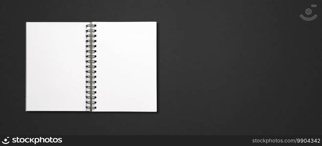 Blank open spiral notebook mockup isolated on black horizontal banner. Blank open spiral notebook isolated on black banner