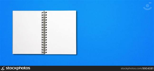 Blank open spiral notebook mockup isolated on blue horizontal banner. Blank open spiral notebook isolated on blue banner
