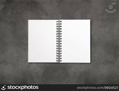 Blank open spiral notebook mockup isolated on dark concrete background. Blank open spiral notebook isolated on dark concrete background
