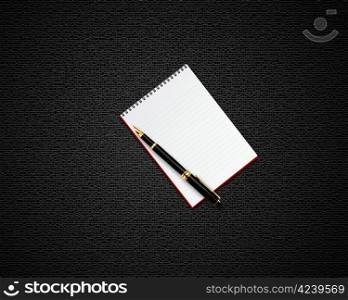 blank opened notebook with black pen.