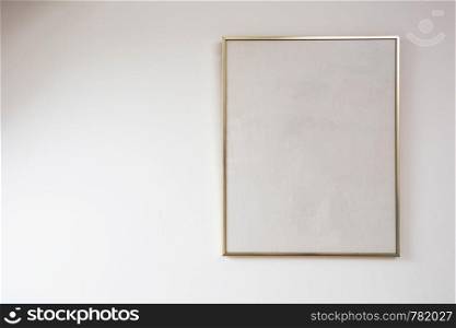 Blank painting on white wall with golden frame, space for text beauty. Blank painting on white wall with golden frame, space for text
