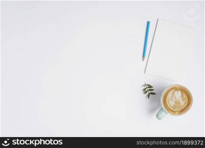 blank paper blue colored pencil cup cappuccino coffee white background. Resolution and high quality beautiful photo. blank paper blue colored pencil cup cappuccino coffee white background. High quality beautiful photo concept