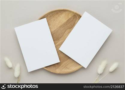 Blank paper cards, Greeting card Mockup with pampas grass on a wooden plate, beige background, Minimal beige workplace composition, flat lay, mockup