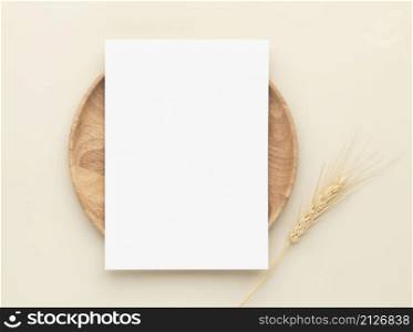 Blank paper cards, Mockup with a wheat on a wooden plate, beige background, Minimal beige workplace composition, flat lay, mockup