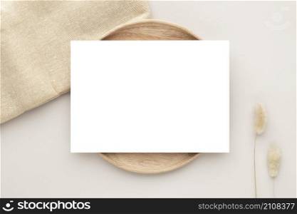 Blank paper cards, Mockup with pampas grass on a wooden plate, beige background, Minimal beige workplace composition, flat lay, mockup