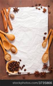 blank paper for recipes over wooden background with coffee and spices