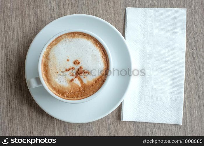 blank paper for your text with hot cappuccino coffee cup on table background at the morning xt