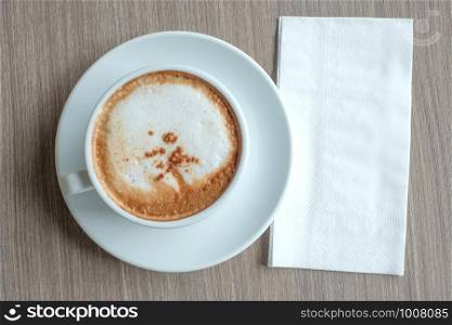 blank paper for your text with hot cappuccino coffee cup on table background at the morning xt