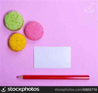 Blank paper sheet and red pencil on a pink background