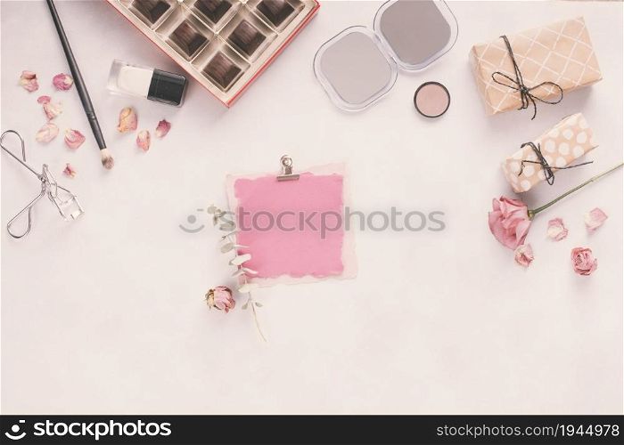 blank paper with gift boxes roses cosmetics. High resolution photo. blank paper with gift boxes roses cosmetics. High quality photo