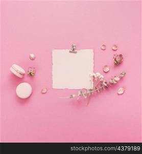 blank paper with macaroons flower branches
