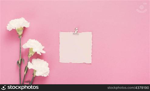 blank paper with white flowers table