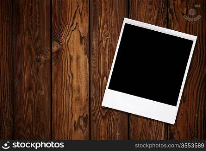 Blank photo on natural wooden background