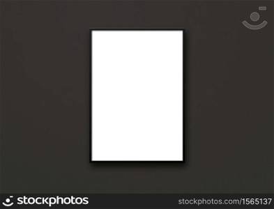 Blank picture frame hanging on a black wall. Presentation mockup template. Blank picture frame hanging on a black wall
