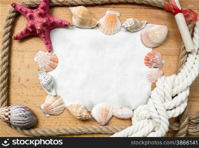 Blank piece of paper with border made from marine knots and seashells