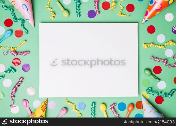 blank placard decorated with birthday items green background