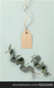 Blank price tags and eucalyptus on blue background mock up