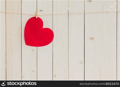 Blank red heart hanging on white wood with space for Valentine and Wedding background.