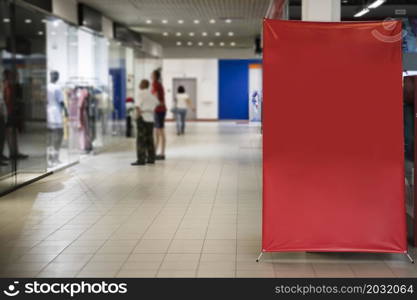 blank red sign inside shopping mall
