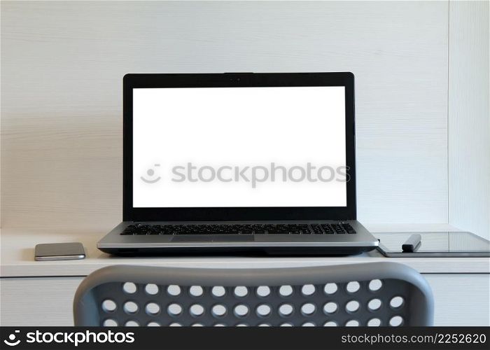 blank screen laptop computer is on twooden desk as workplace concept
