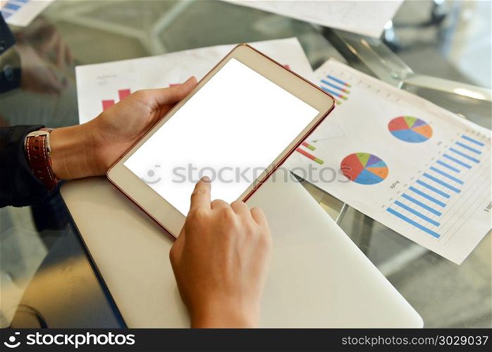 Blank Screen Tablet and business documents on meeting table