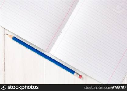 Blank sheet of lined notebook with pencil