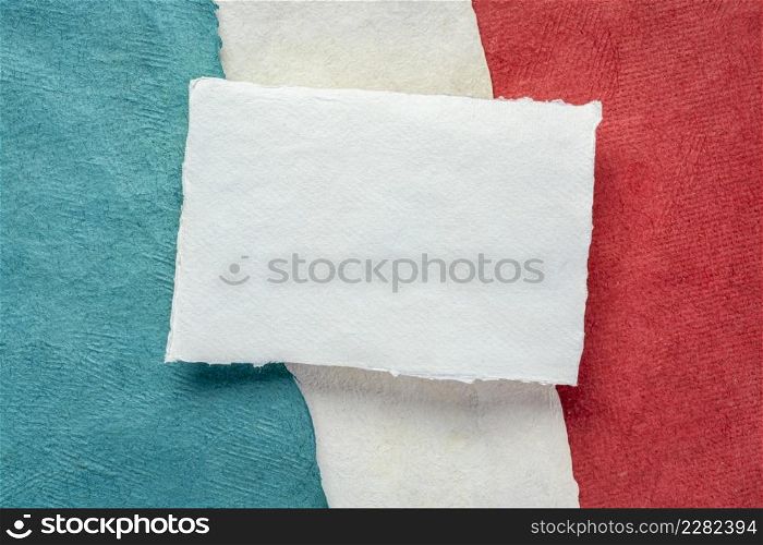 blank sheet of white textured paper against abstract in colors of France national flag - blue, white and red, set of textured, handmade, bark paper sheets