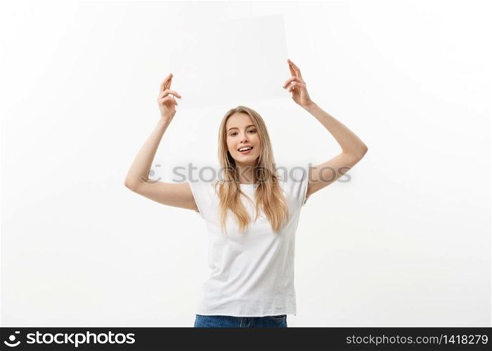 Blank sign. Woman holding empty blank white sign above her head. Excited and happy beautiful young woman isolated on white background. Blank sign. Woman holding empty blank white sign above her head. Excited and happy beautiful young woman isolated on white background.