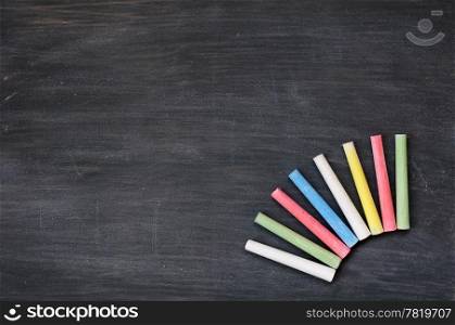 Blank smudged blackboard background with colorful chalk for text writing and design