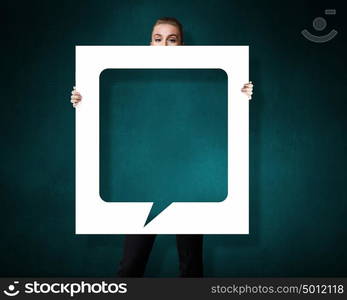 Blank speech bubble. Businesswoman holding banner with blank speech bubble