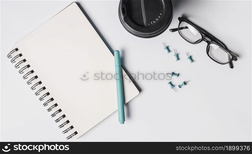 blank spiral notepad pen coffee cup eyeglasses pushpins white background. Resolution and high quality beautiful photo. blank spiral notepad pen coffee cup eyeglasses pushpins white background. High quality beautiful photo concept