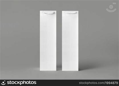 Blank tall white wine bottle bag mockup set, isolated, 3d rendering. Empty carry handbag for wine or vodka mock up. Clear paper packaging fit for store branding.