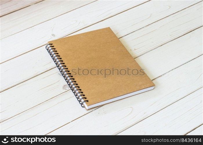 Blank vintage paper notebook on wood table