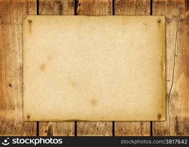 Blank vintage poster nailed on a wood board panel. Blank vintage poster nailed on a wood board