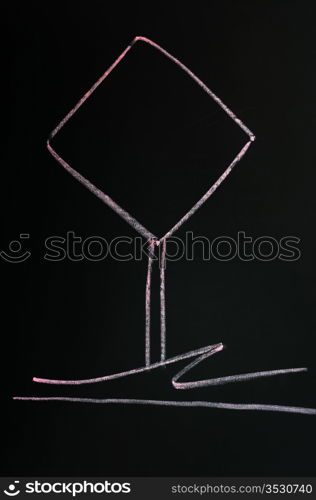 Blank warning sign drawn with red chalk on a blackboard background