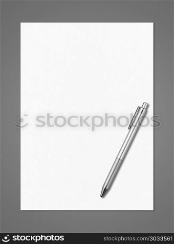 Blank White A4 paper sheet and pen mockup template isolated on dark grey background. Blank White A4 paper sheet and pen mockup template. Blank White A4 paper sheet and pen mockup template