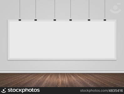 Blank white banner. Blank banner hanging on wall. Place for text