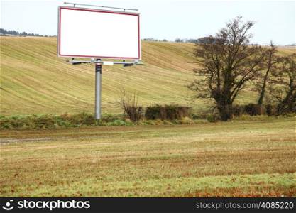 Blank white billboard in field with space for your advertisement