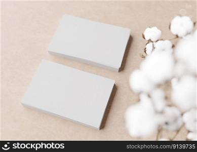 Blank white business cards with cotton plant on light brown background. Natural mockup for branding identity. Two cards to show both sides. Template for graphic designer. Free space. 3D rendering. Blank white business cards with cotton plant on light brown background. Natural mockup for branding identity. Two cards to show both sides. Template for graphic designer. Free space. 3D rendering.