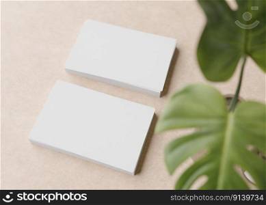Blank white business cards with monstera plant on light brown background. Natural mockup for branding identity. Two cards to show both sides. Template for graphic designer. Free space. 3D rendering. Blank white business cards with monstera plant on light brown background. Natural mockup for branding identity. Two cards to show both sides. Template for graphic designer. Free space. 3D rendering.
