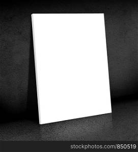 Blank white Canvas poster leaning at black cement room, Mock up for add your content,business presentation template.