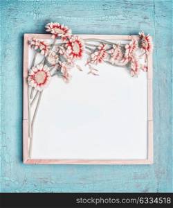 Blank white chalkboard and pretty pastel color flowers bunch on turquoise shabby chic background, top view, frame. Layout for greeting of Mothers day, wedding, Birthday or happy event